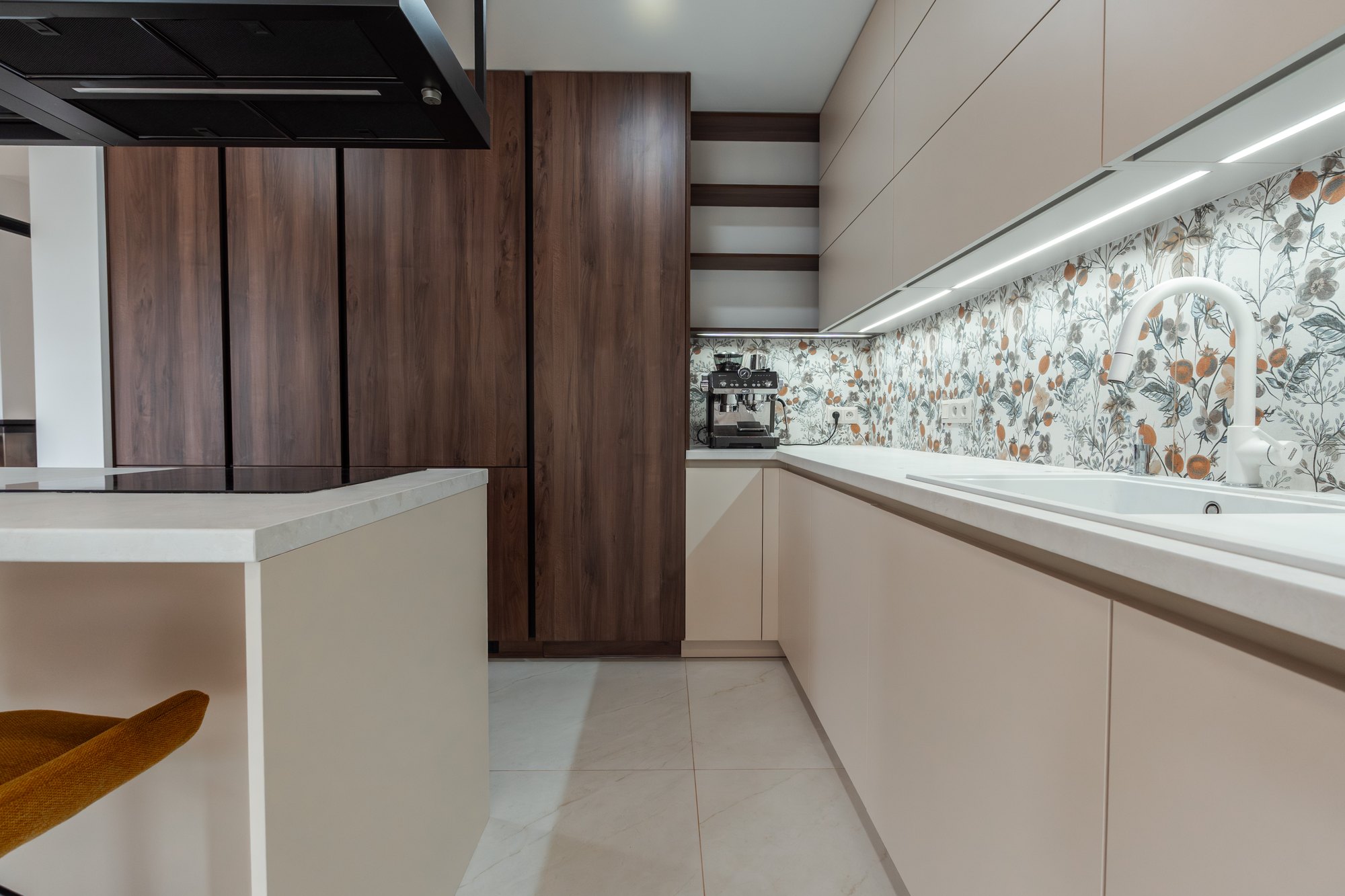Bespoke kitchen unit combining Tobacco Pacifik Walnut veneer and beige satin with a Cremona Marble worktop, Borský Mikuláš.