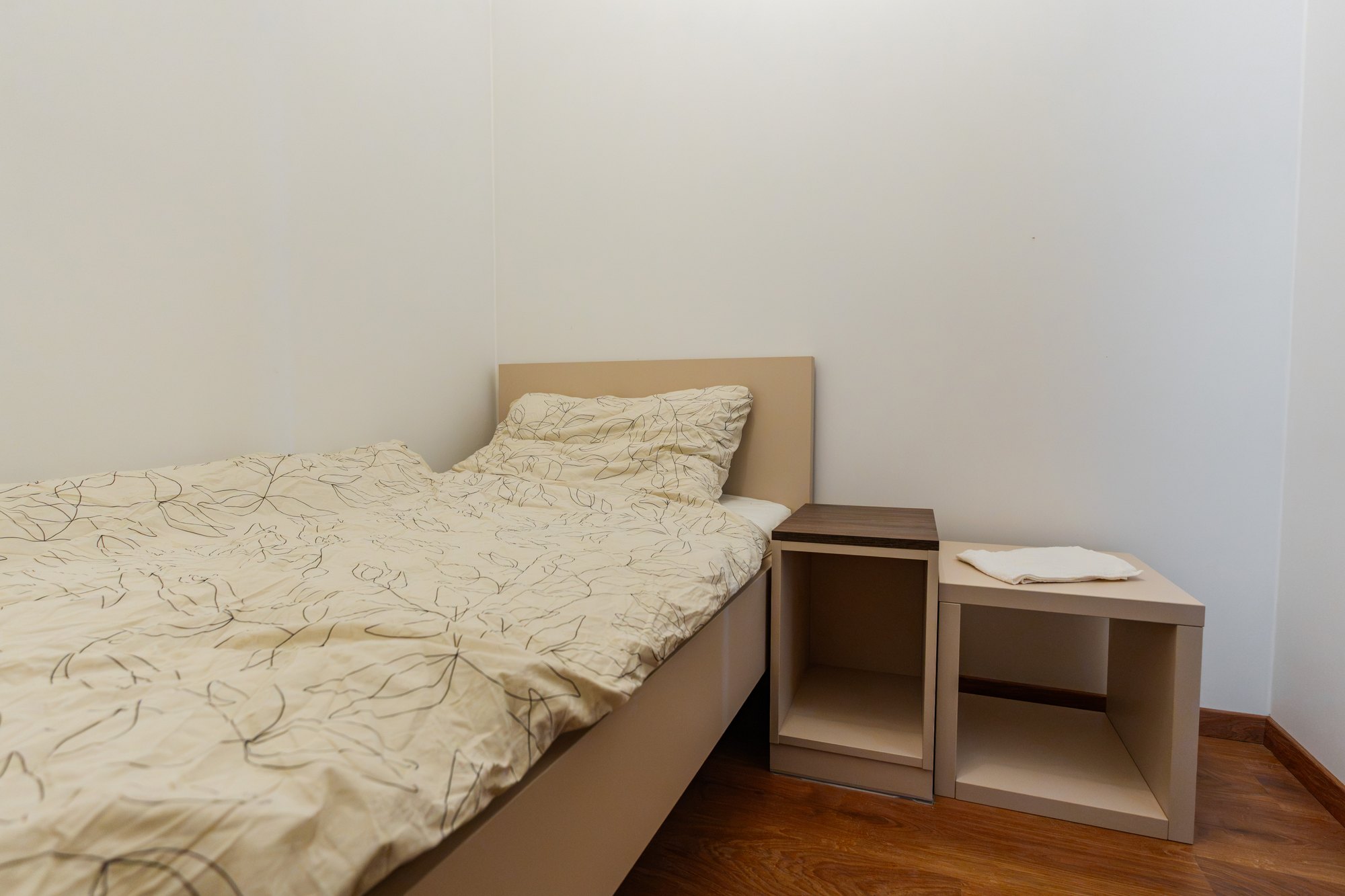 Custom-made double bed with bedside tables in a combination of Satin and Brown Davos Oak laminate, Bratislava.