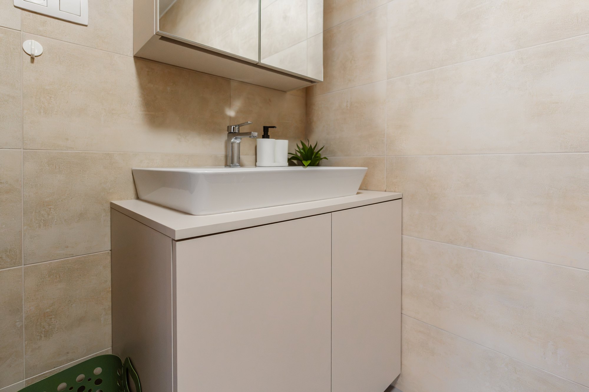 Bathroom cabinet with a countertop basin in Satin & Black Pietra Grigia laminate finish and a mirrored cabinet, Bratislava.