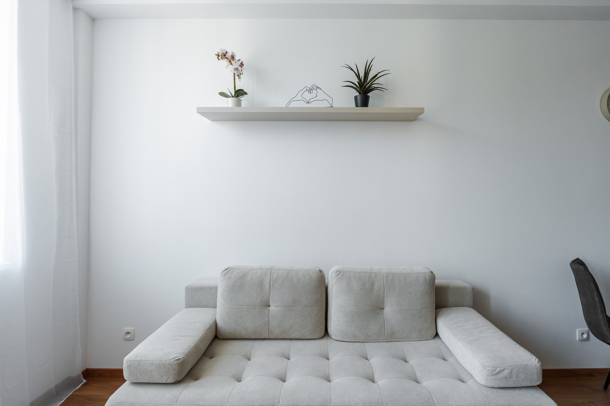 Grey sofa set with a floating wall shelf in Satin & Brown Davos Oak shade, living room, Bratislava.